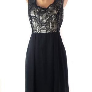 Стильна чорна сукня з елегантним декором - модний тренд 2025