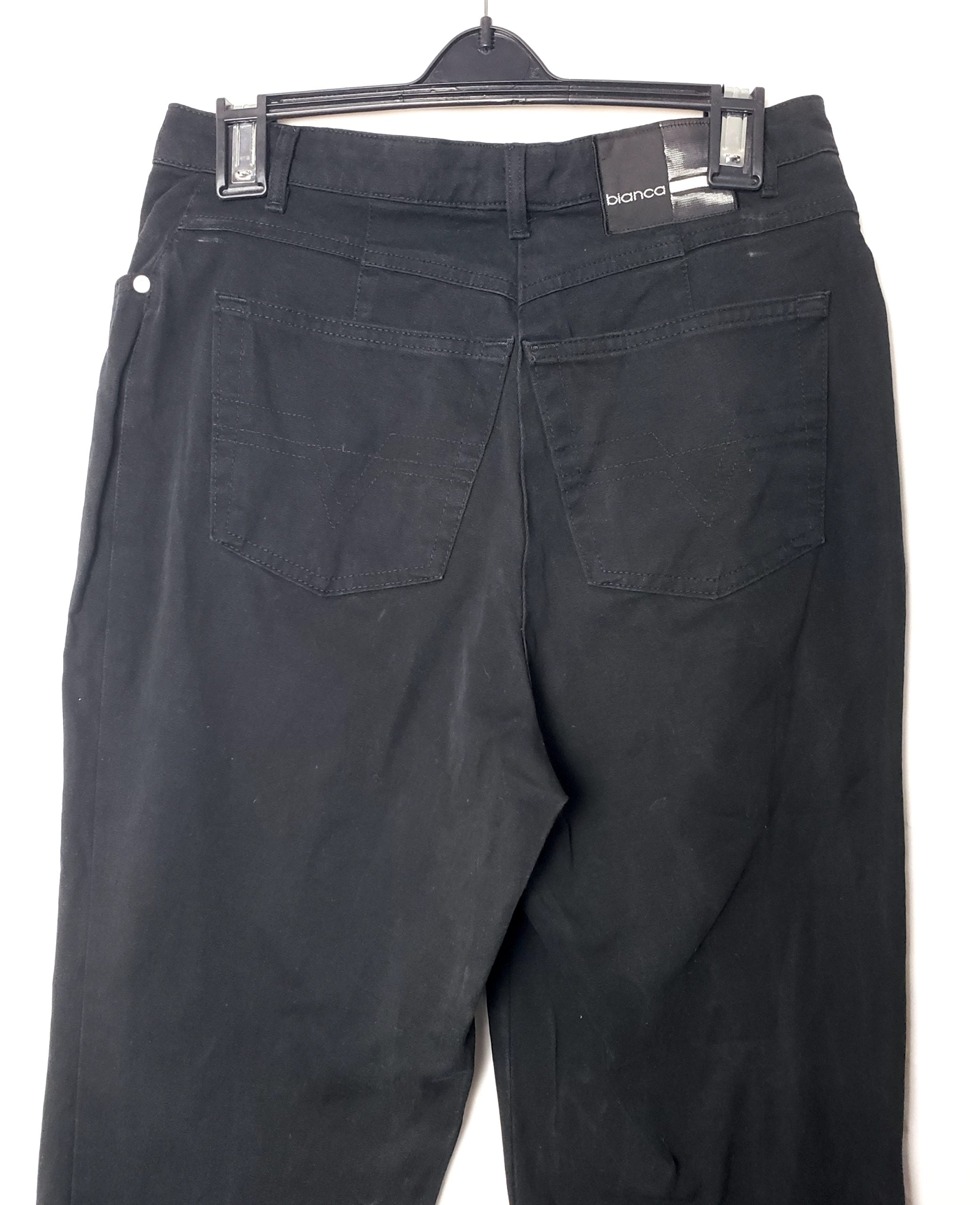 Стильні чорні джинси з еластаном - елегантний модний образ для сучасної жінки 4 Стильні чорні джинси з еластаном - елегантний модний образ для сучасної жінки - Зображення 4